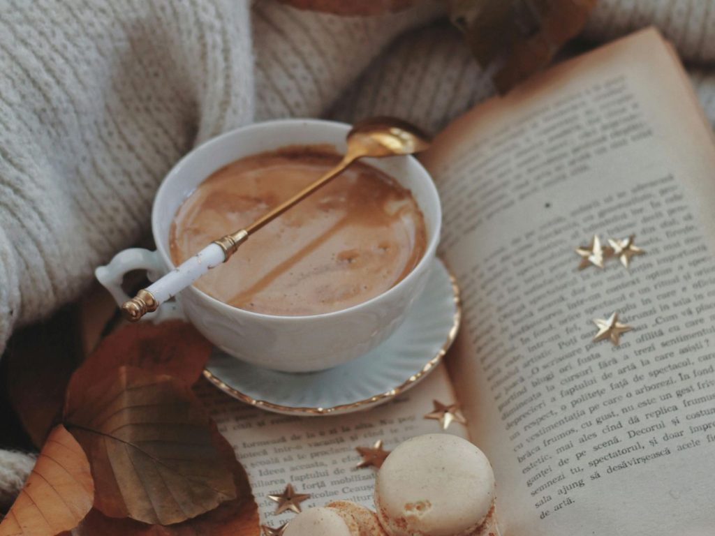 Woman drinking coffee while working, exploring caffeine's role in ADHD management – psychologist ADHD testing Sugar Land