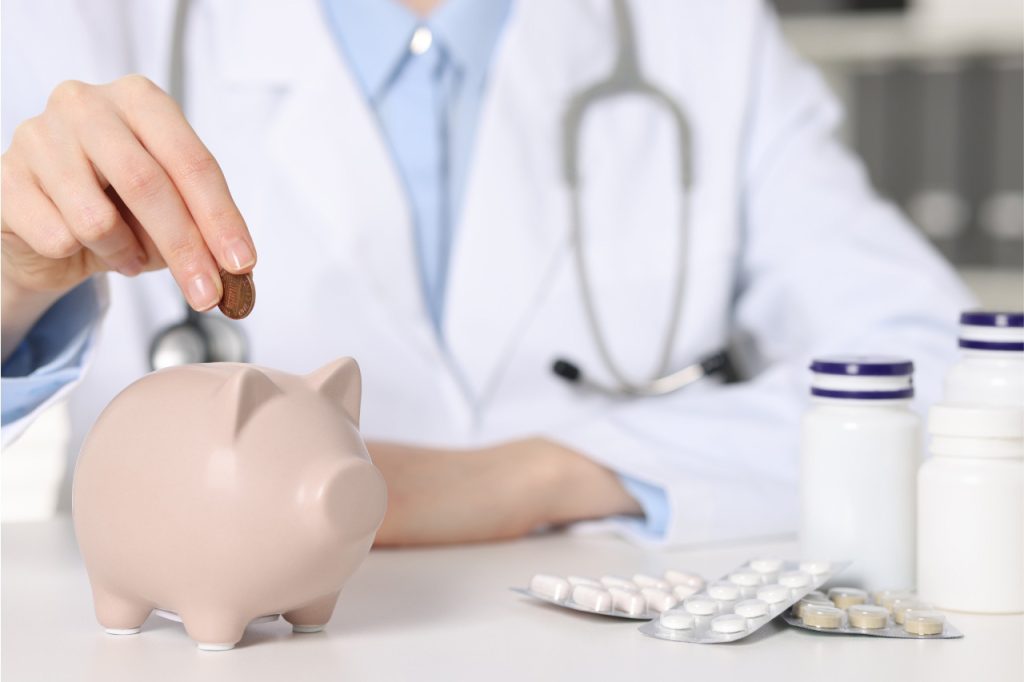 Doctor reviewing depression treatment costs with piggy bank and medication, Blue Cross Shield Insurance depression doctor Sugar Land