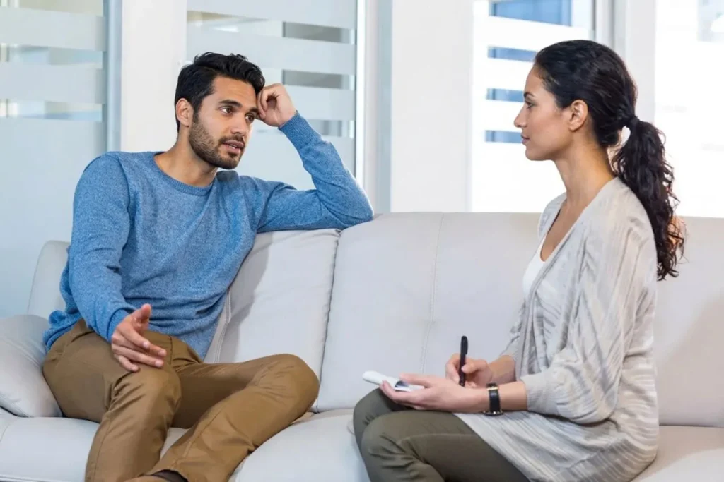 A medical professional consults with an individual in a bright clinic specializing in bipolar psychiatry sugar land.