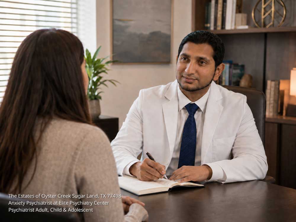 A professional anxiety psychiatrist in Sugar Land listening to a female patient while taking notes.