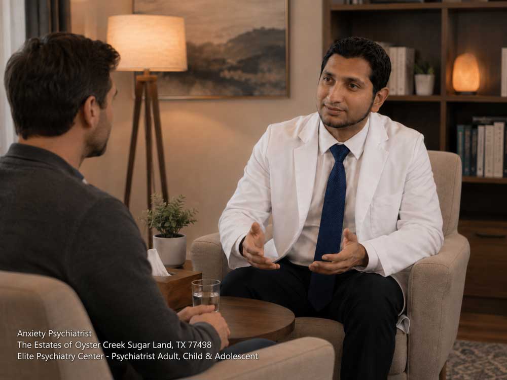 An experienced anxiety psychiatrist in Sugar Land talking with a male patient during a therapy session.