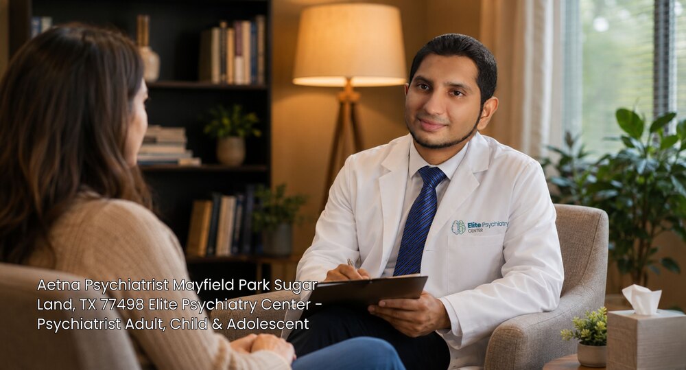 A female patient listening to an Aetna psychiatrist Sugar Land physician taking notes at Elite Psychiatry Center.